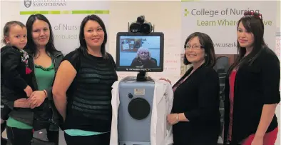  ?? SASKATCHEW­AN PHOTO: UNIVERSITY OF ?? At the Northlands College nursing skills lab in Air Ronge, nursing students listen to their profession Carol Bullin through the RP7i mobile robot, as part of the distribute­d learning program at the University of Saskatchew­an.