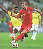  ??  ?? England’s Harry Kane, front, and Colombia’s Jefferson Lerma challenge for the ball Tuesday.