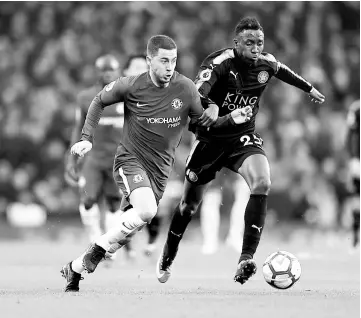  ?? — Reuters photo ?? Leicester City’s Wilfred Ndidi (right) in action with Chelsea’s Eden Hazard during the English Premier League match at Stamford Bridge in London.