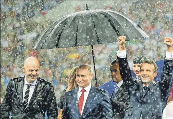  ??  ?? Football unites: Fifa boss Gianni Infantino (left), Russian President Vladimir Putin and France’s Emmanuel Macron. Photo: Kai Pfaffenbac­h/Reuters