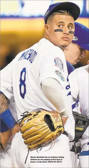  ??  ?? Manny Machado has an eyebrow-raising defense for not running to first base in Game 2 of the NLCS. PHOTO BY GETTY