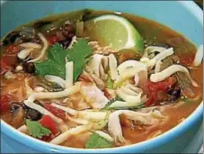  ?? PHOTO COURTESY OF BRENDA KIEFFER ?? Top this chicken tortilla soup with Monterey Jack cheese and chopped cilantro.