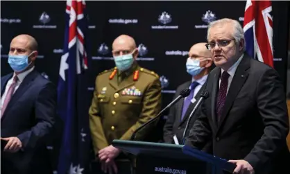  ?? Photograph: Lukas Coch/EPA ?? The Australian prime minister, Scott Morrison, far right, while releasing the Doherty Institute Covid modelling report for national cabinet.