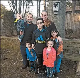  ?? JOSEPH TANFANI/LOS ANGELES TIMES ?? Hector Soriano and his fiancee, Jennifer Carlsen, with, from left, Tomas, 10 mos.; Manny, 3; Antonio, 12; Jasmine, 5 and Vincent, 7. Antonio is Jennifer’s from a previous union.