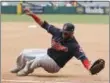  ?? CHRIS CARLSON — THE ASSOCIATED PRESS ?? Indians first baseman Carlos Santana fields a ball hit down the first base line by the Angels’ Kole Calhoun during the fourth inning.