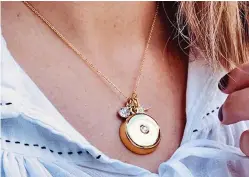  ??  ?? Pendant power: The necklace can send an alert to family