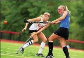  ?? BILL RUDICK — FOR DIGITAL FIRST MEDIA ?? Downingtow­n West’s Anna Miller shoots in front of West Chester East’s Kinzie Thompson.