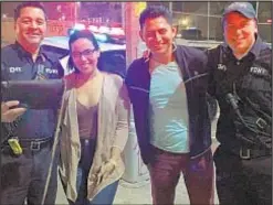  ??  ?? FDNY EMTs Stuart Saladin (left) and Zach Arias with Bronx couple they helped after purse snatching in the Bronx on Monday.