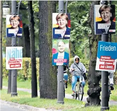  ??  ?? Campaign posters in Berlin supporting Angela Merkel for next month’s general election