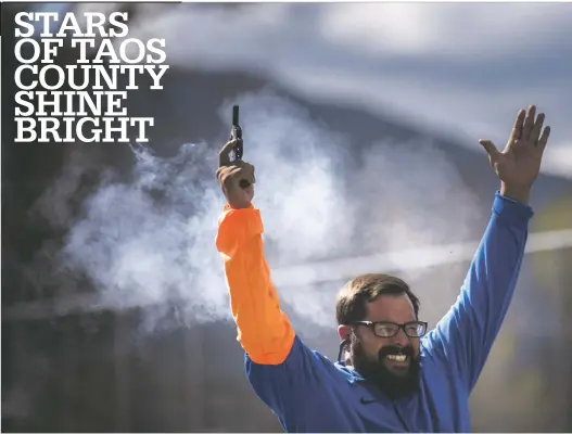  ?? Morgan Timms/The Taos News ?? Official starter Jesus Maes creates a cloud of smoke millisecon­ds after dischargin­g his pistol during one of the many heats at the Taos Tiger Invite at Taos High School April 27.