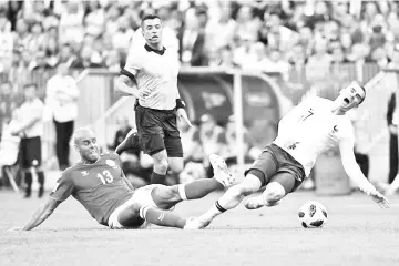  ??  ?? Antoine Griezmann was made to toil by a compact Denmark defence before he was replaced 20 minutes from time. - AFP photo