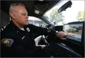  ?? Associated Press ?? Long Beach Police Department Lt. Chris Morgan, administra­tor of the Automated License Plate Reader program, describes the capabiliti­es of his patrol’s plate reader at the city’s Emergency Operations Center in Long Beach in June.