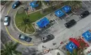  ?? Photograph: Joe Raedle/Getty Images ?? An aerial view of vehicles passing through as they receive food from a food bank in Sunrise, Florida, on 6 April.