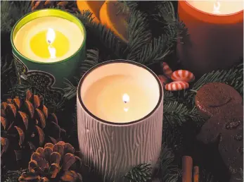  ?? CITIZEN NEWS SERVICE PHOTO ?? Scented candles can transport you back, especially during the holidays.