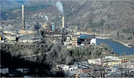  ?? CANADIAN PRESS FILES ?? Teck Resources’s zinc and lead smelting and refining complex, left, is pictured in Trail, B.C. The company made a small profit in the second quarter, but is hopeful that better days are ahead as commodity prices continue to recover.