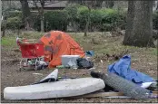  ??  ?? A tent and belongings are seen Wednesday after Chico’s Public Works Department staff cleared campsites a day earlier in Bidwell Park in Chico.