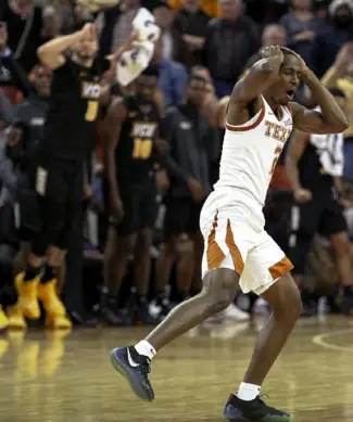  ?? The Associated Press ?? Matt Coleman III reacts after missing a game-winning shot for Texas against Virginia Commonweal­th Dec. 5. After a hot start, Shaka Smart’s Longhorns are struggling.