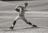  ??  ?? Texas A&M pitcher Asa Lacy says when he was younger, “Anything I could get my hands on to throw, I threw.”