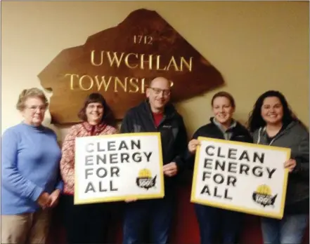  ?? SUBMITTED PHOTO ?? Uwchlan supervisor­s hold signs proclaimin­g they support clean energy.