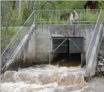  ?? GARY NYLANDER/The Daily Courier ?? Spring runoff has caused the level of Mission Creek to rise significan­tly. Diversion channel gates have been opened to allow more water to flow through.