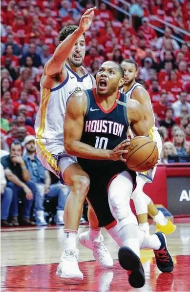  ?? Brett Coomer / Houston Chronicle ?? Rockets guard Eric Gordon, right, drives to the basket during Thursday’s Game 5 win at Toyota Center. Gordon is averaging 5.8 points in 8.3 minutes in the fourth quarters of the Western Conference finals games against the Warriors.