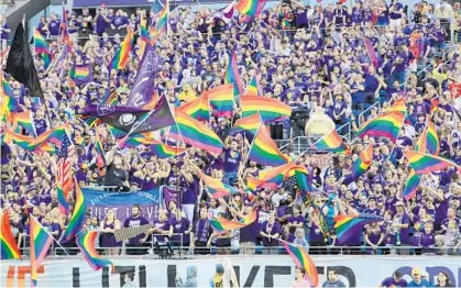  ?? JACOB LANGSTON/ORLANDO SENTINEL ?? Fans go wild before the start of the MLS match between Orlando City and San Jose at Camping World Stadium in Orlando on June 18, 2016.