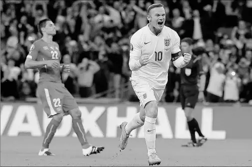  ?? FRANK AUGSTEIN / ASSOCIATED PRESS ?? Wayne Rooney celebrates scoring England’s second goal during Tuesday’s 2-0 Euro 2016 qualifying win over Switzerlan­d at Wembley stadium in London. It was Rooney’s 50th internatio­nal goal, passing Bobby Charlton as England’s all-time leading scorer.