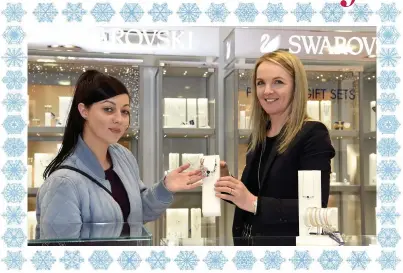  ??  ?? Mary Counihan showing customer Samantha O Donoghue a necklace from the new Swarovski range at Adams Jewellers, College Street, Killarney.