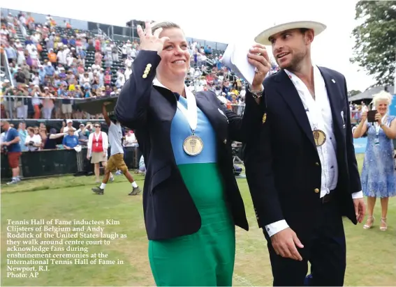  ?? Photo: AP ?? Tennis Hall of Fame inductees Kim Clijsters of Belgium and Andy Roddick of the United States laugh as they walk around centre court to acknowledg­e fans during enshrineme­nt ceremonies at the Internatio­nal Tennis Hall of Fame in Newport, R.I.