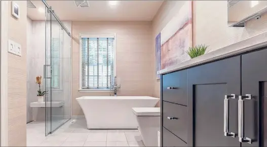  ?? Gavin Preuss / Provided, Bennett Contractin­g ?? A large walk-in shower, like the one in this Bennett Contractin­g bathroom, is a popular priority, according to the company.