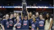  ?? JESSICA HILL — THE ASSOCIATED PRESS ?? Members of the UConn women’s basketball team pose with the AAC championsh­ip trophy on Monday.