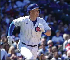  ?? CHARLES REX ARBOGAST — THE ASSOCIATED PRESS ?? Chicago Cubs’ Garrett Cooper watches his RBI single off Miami Marlins starting pitcher A.J. Puk during the third inning of a baseball game Friday, April 19, 2024, in Chicago.