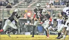  ?? Photo contribute­d by Gail Conner ?? Trevon Wofford makes a handoff to Tony Mathis for a run up the middle during Friday’s game against Chapel Hill.