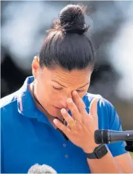  ?? PHOTOS (main and above) / BRETT PHIBBS ?? An emotional Dame Valerie Adams with her children Kepaleli and Kimoana after she announces her retirement from the sport of shot put.