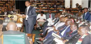  ??  ?? President Emmerson Mnangagwa, Vice President Constantin­o Chiwenga (obscured), Vice President Kembo Mohadi Government officials and Members of Parliament listen as Finance Minister Mthuli Ncube (standing) presents the 2019 National Budget in Harare yesterday