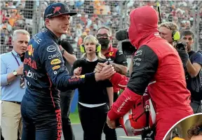  ?? AP ?? Ferrari’s Charles Leclerc, far right, took pole for today’s Australian Grand Prix. Above, Red Bull’s Max Verstappen, left, congratula­tes Leclerc. Aussie Daniel Ricciardo, right, has his McLaren seventh on the grid.