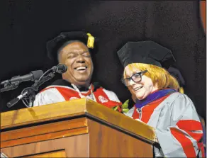 ?? Josh Hawkins UNLV ?? UNLV President Keith E. Whitfield shares a laugh with Ann-Margret as she receives an honorary doctorate from UNLV on Saturday.
