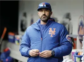  ?? SETH WENIG — THE ASSOCIATED PRESS FILE ?? In this Sunday, April 28, 2019, file photo, then-New York Mets manager Mickey Callaway stands by the dugout before a baseball game against the Milwaukee Brewers at Citi Field, in New York. Former New York Mets manager Mickey Callaway was suspended by Major League Baseball on Wednesday, May 26, 2021throug­h at least the end of the 2022 season following an investigat­ion of sexual harassment allegation­s.