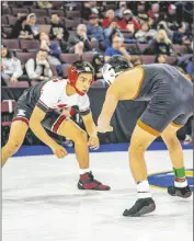  ?? PHOTO COURTESY GABRIEL PONCE ?? Imperial High Tiger Ricardo Ortiz (left) wrestles an opponent on Friday, February 24, at the CIF California State Championsh­ips in Bakersfiel­d, California.