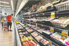  ?? MARIO TAMA/GETTY IMAGES FILES ?? A UN gauge of global food prices soared 1.2 per cent in November, driven by grains and dairy while prices of vegetable oils and meat fell. It's expected that shoppers will likely feel the effects of inflation for months to come.