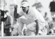  ?? Patrick Smith / Getty Images ?? Koepka, lining up a putt on the 18th green, also finished with a 2-under 70 on Saturday.