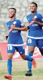  ?? FILE ?? Maalique Foster (left) and Portmore United teammate Cleon Pryce celebratin­g a goal in the Red Stripe Premier League at the Spanish Town Prison Oval.