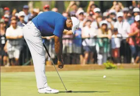  ?? Charlie Riedel / Associated Press ?? Tiger Woods reacts to a missed birdie putt on the 11th green during the third round of the PGA Championsh­ip on Saturday.