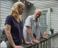  ?? The Associated Press ?? HARD TIMES FOR LILY FARMING: Alison Eastwood, left, and Clint Eastwood in a scene from "The Mule."