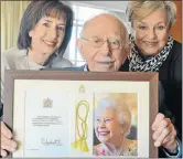  ?? Picture: IVOR MARKMAN ?? HAPPY 100 YEARS: Denzil Levy, with the card and greeting he received from Queen Elizabeth. With him from London are his daughters, Marilyn Smith and Fanelle Galaun