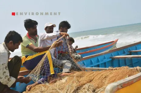  ??  ?? (Left) Most of Salaya's fisherfolk have quit fishing since Essar Bulk Terminal Ltd started constructi­ng a jetty (below) in their fishing ground