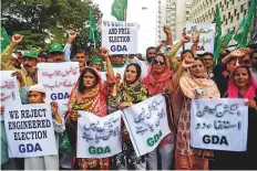  ?? AFP ?? Activists of Grand Democratic Alliance party protest against ■ alleged election rigging in Karachi yesterday.