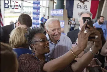  ?? RACHEL MUMMEY — THE NEW YORK TIMES ?? Former Vice President Joe Biden takes a photo with local resident Sandra Pope during an event in Ottumwa, Iowa.