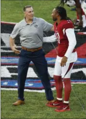  ?? RON SCHWANE — ASSOCIATED PRESS ?? Former St. Louis Rams and Arizona Cardinals quarterbac­k Kurt Warner, left, greets Cardinals wide receiver Larry Fitzgerald before the Pro Football Hall of Fame NFL preseason game in Canton, Ohio, on Thursday.