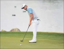  ?? Steve Dykes Getty Images ?? ANDREW LANDRY putts on No. 18 to win the American Express by two shots over Abraham Ancer at La Quinta after squanderin­g a six-stroke lead.